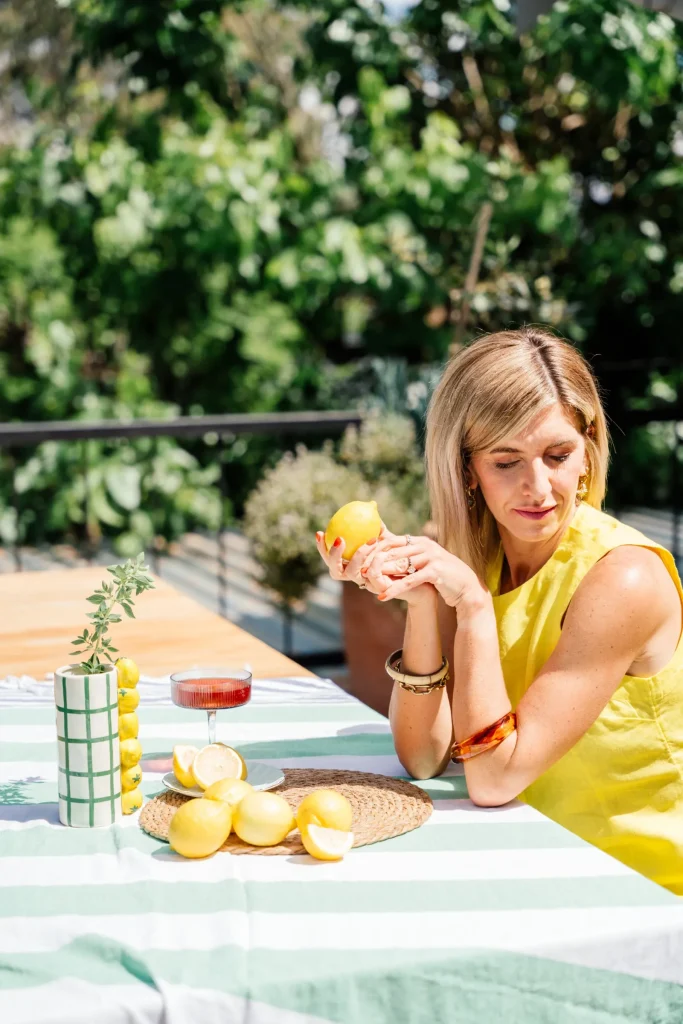 Jeanine at a striped table laid with lemons